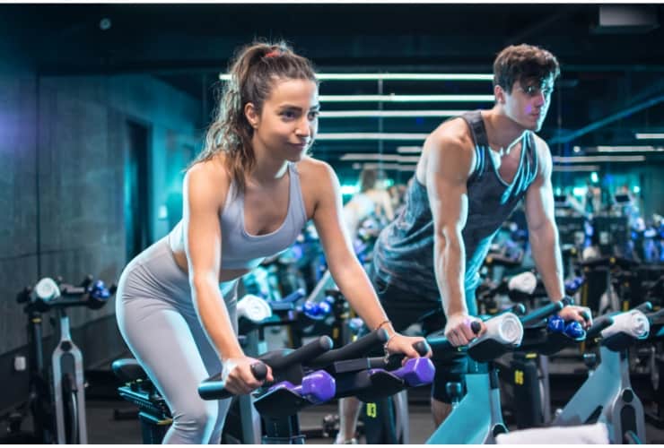 spinning bike vs exercise bike featured canva